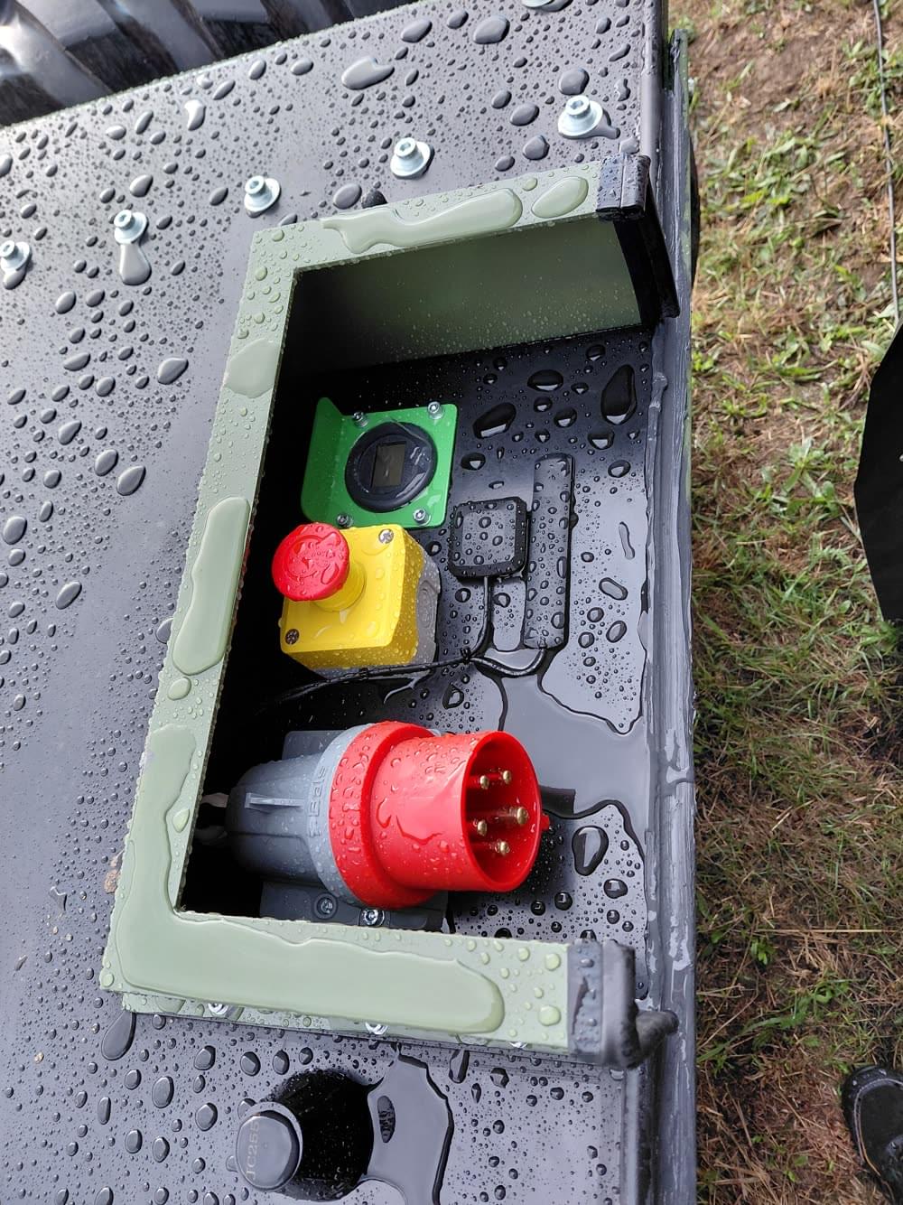 Control panel on the WF25 prototype with emergency stop button and power connector